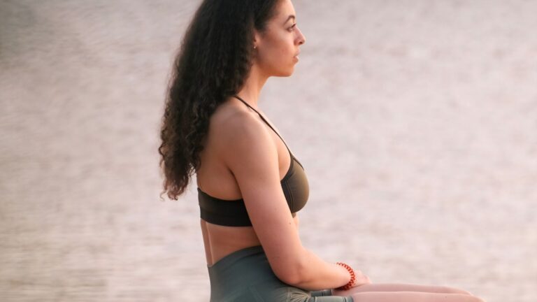 Summer glow up tips, a girl by the beach after building summer confidence sustainably.